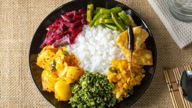 Sri Lankan rice and curry with multiple vegetable and meat curries