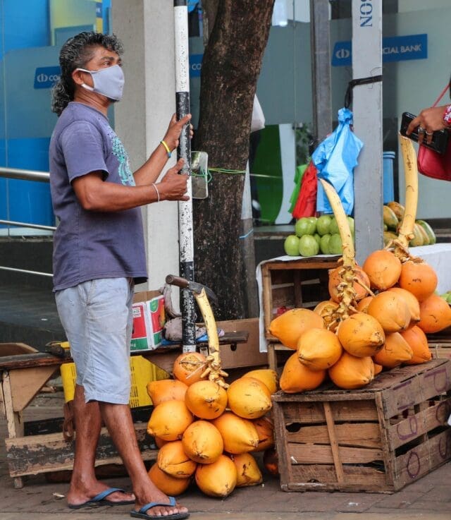 King coconut drink Sri Lanka street vendor